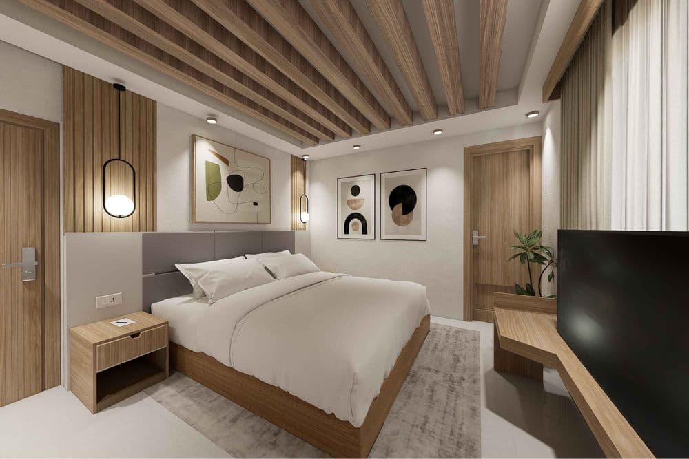 Deluxe Lake View room with a seating nook framing the lake and forested hills